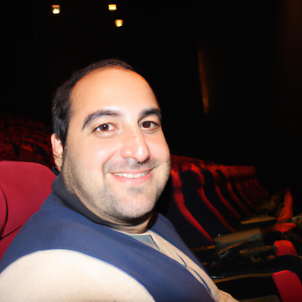 Person attending theater show, smiling